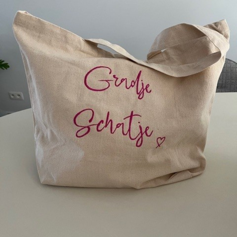shopper van katoen met grote tekst of tekening