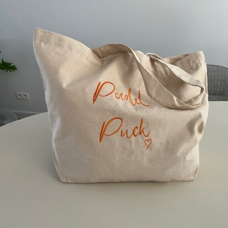 shopper van katoen met grote tekst of tekening