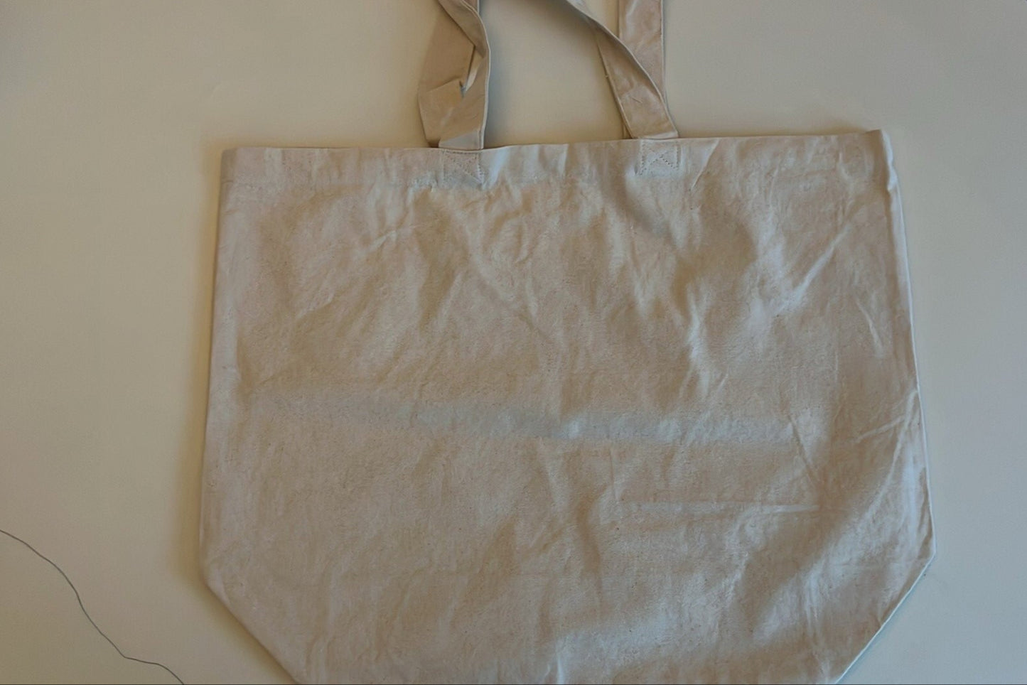 shopper van katoen met grote tekst of tekening